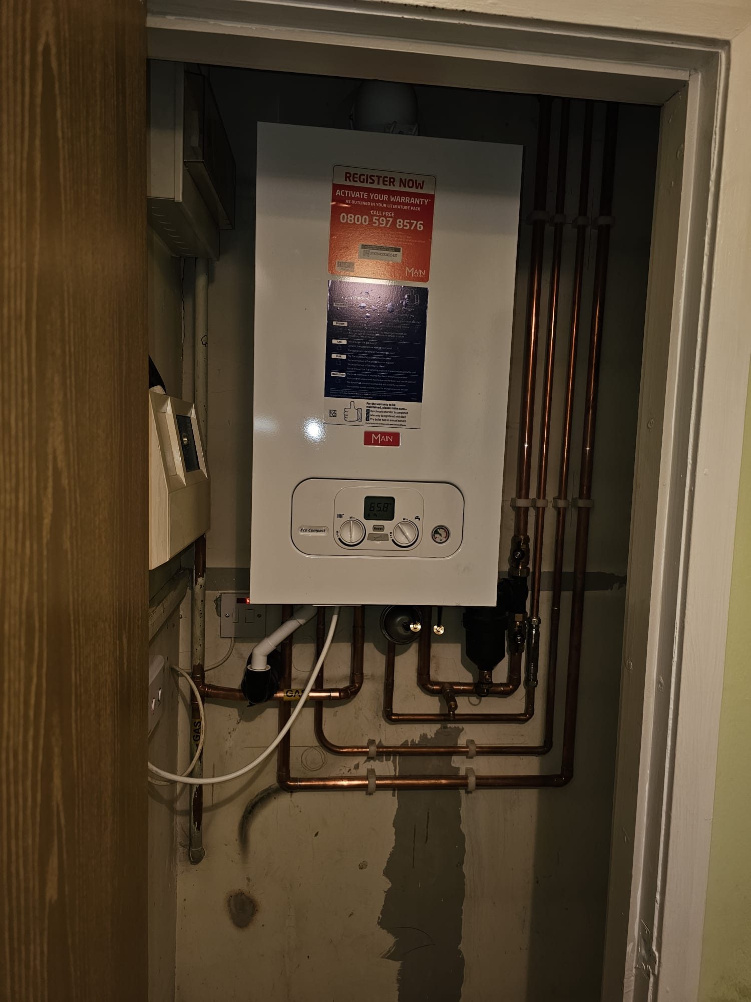 MAIN combi boiler installed in cupboard